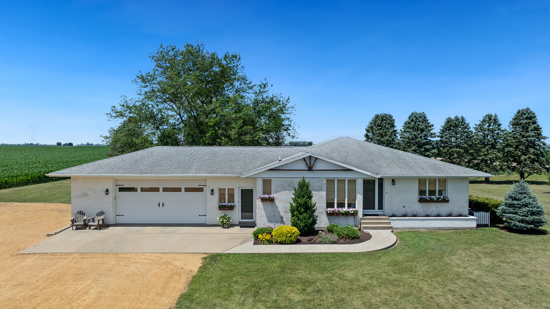 a front view of a house with a garden and porch