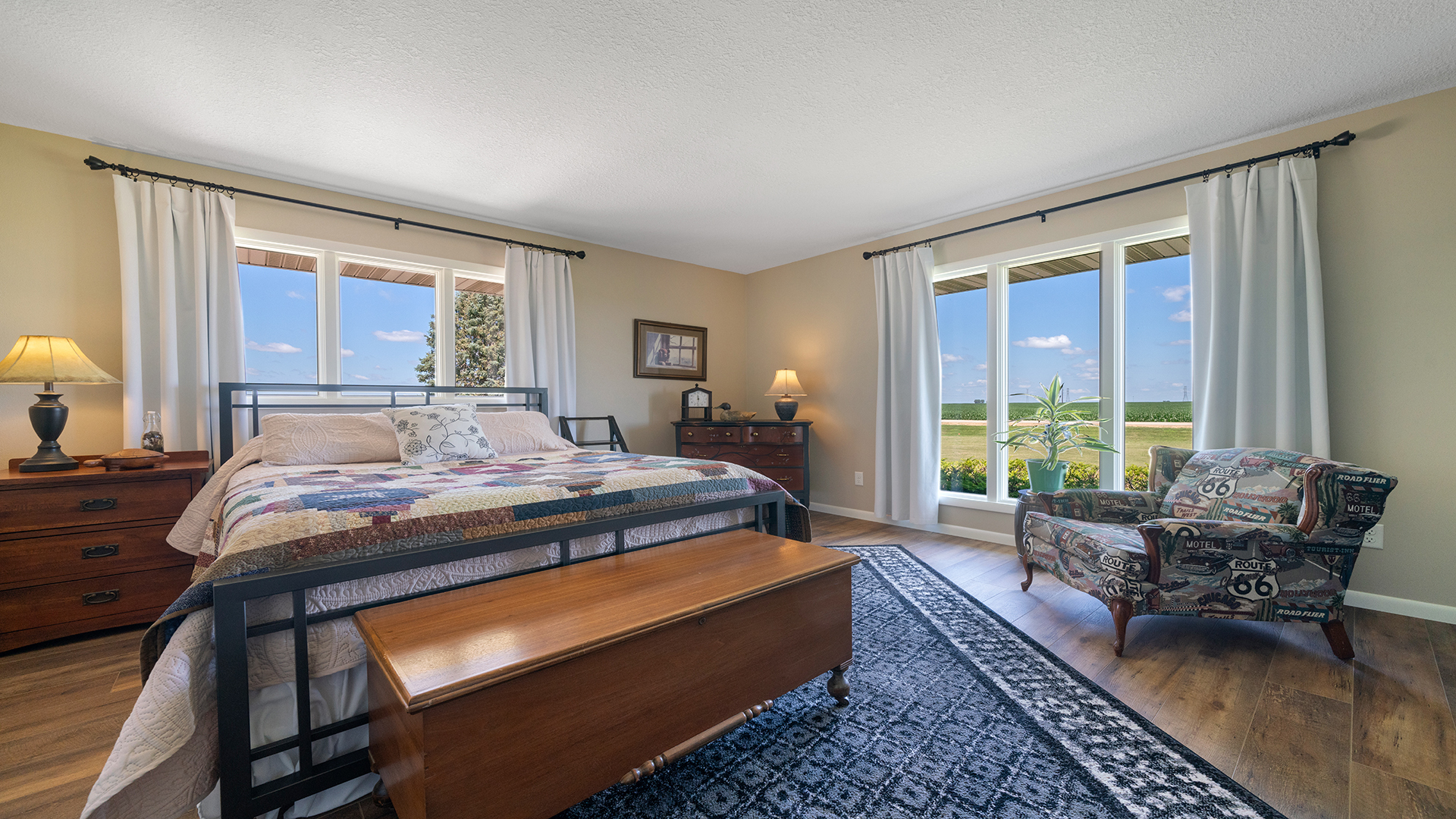 1195 Atkinson Road Harmon, IL 61042 - Photo 23 of 53 a bedroom with a large bed couch and a large window