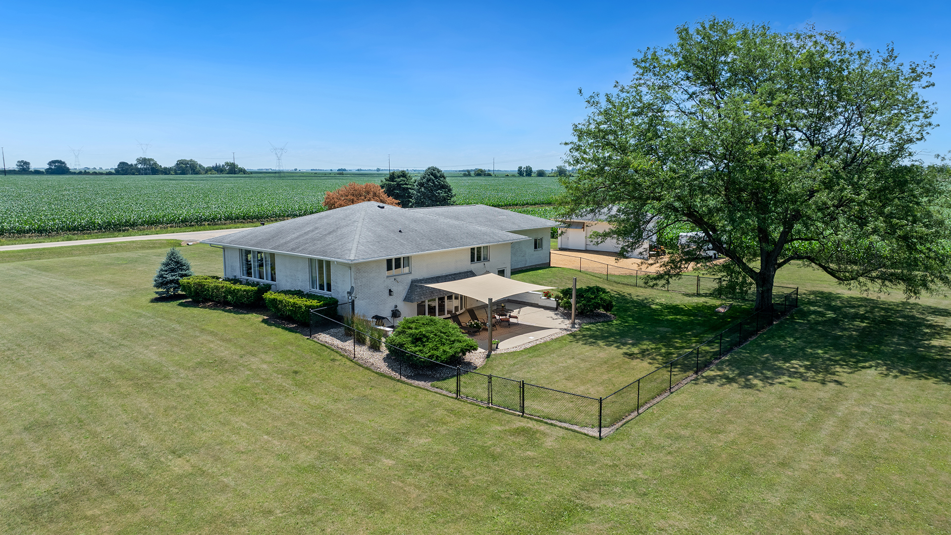 1195 Atkinson Road Harmon, IL 61042 - Photo 45 of 53 an aerial view of a house with garden space and a street view