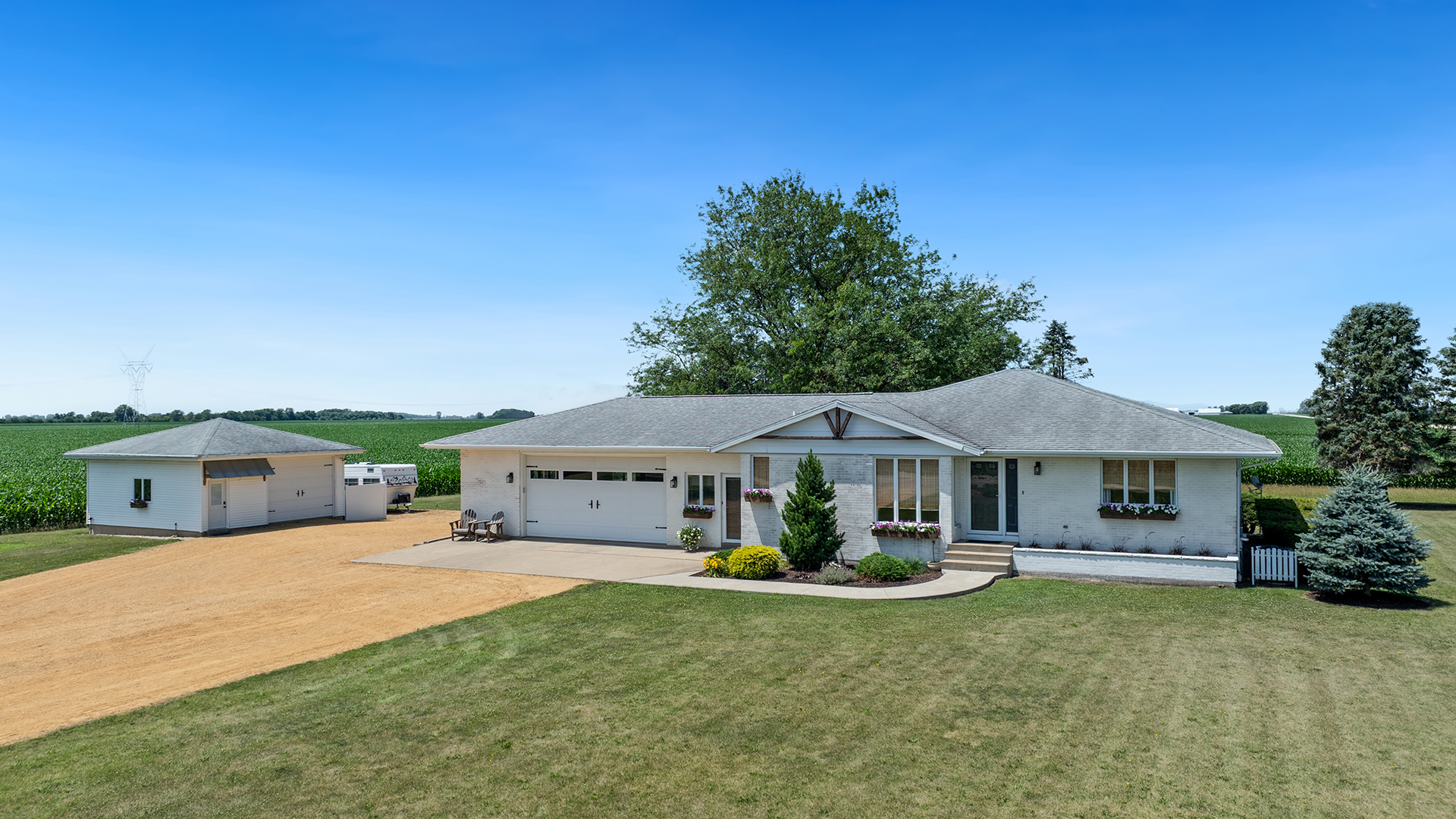 1195 Atkinson Road Harmon, IL 61042 - Photo 46 of 53 a front view of a house with garden