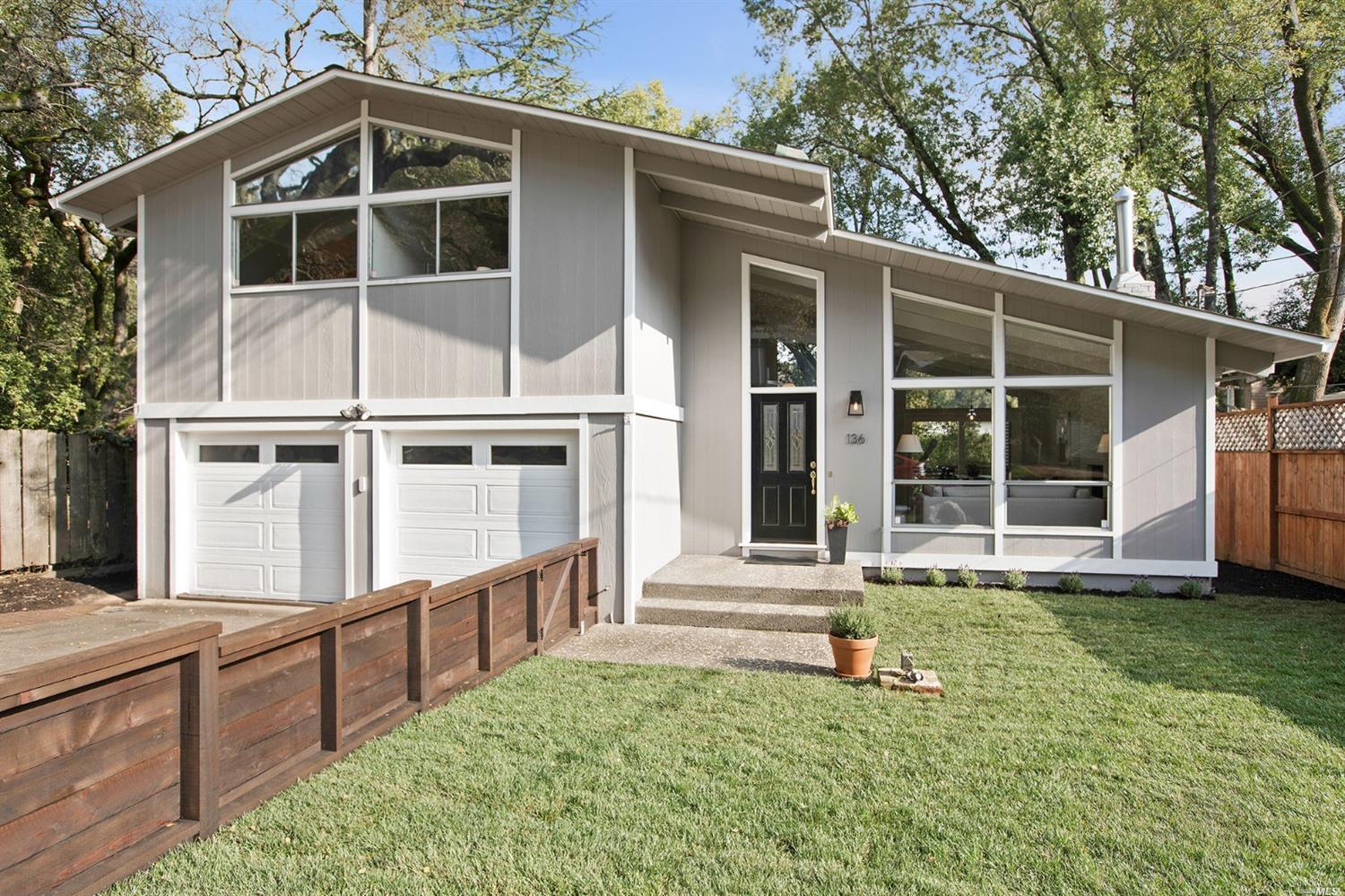 136 Butterfield Road San Anselmo, CA 94960 - Photo 1 of 1 a view of a house with a yard and large tree