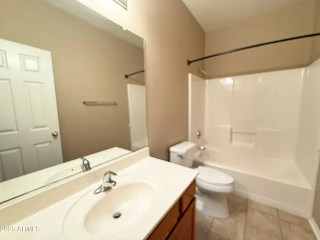 a balcony with trees in front of it