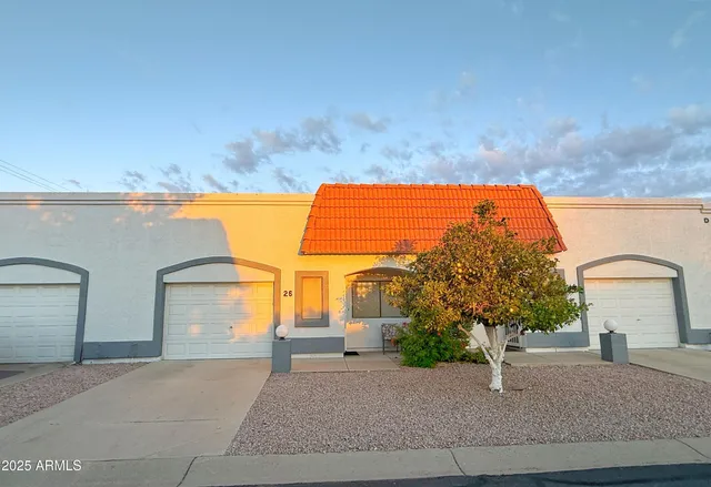 a view of house with a yard