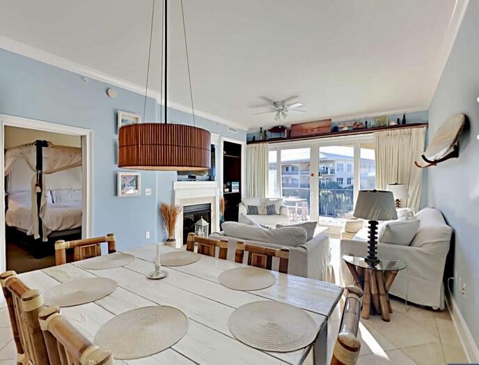 2421 West County Highway 30A, Unit E303 Santa Rosa Beach, FL 32459 - Photo 6 of 23 a living room with furniture a fireplace and a flat screen tv