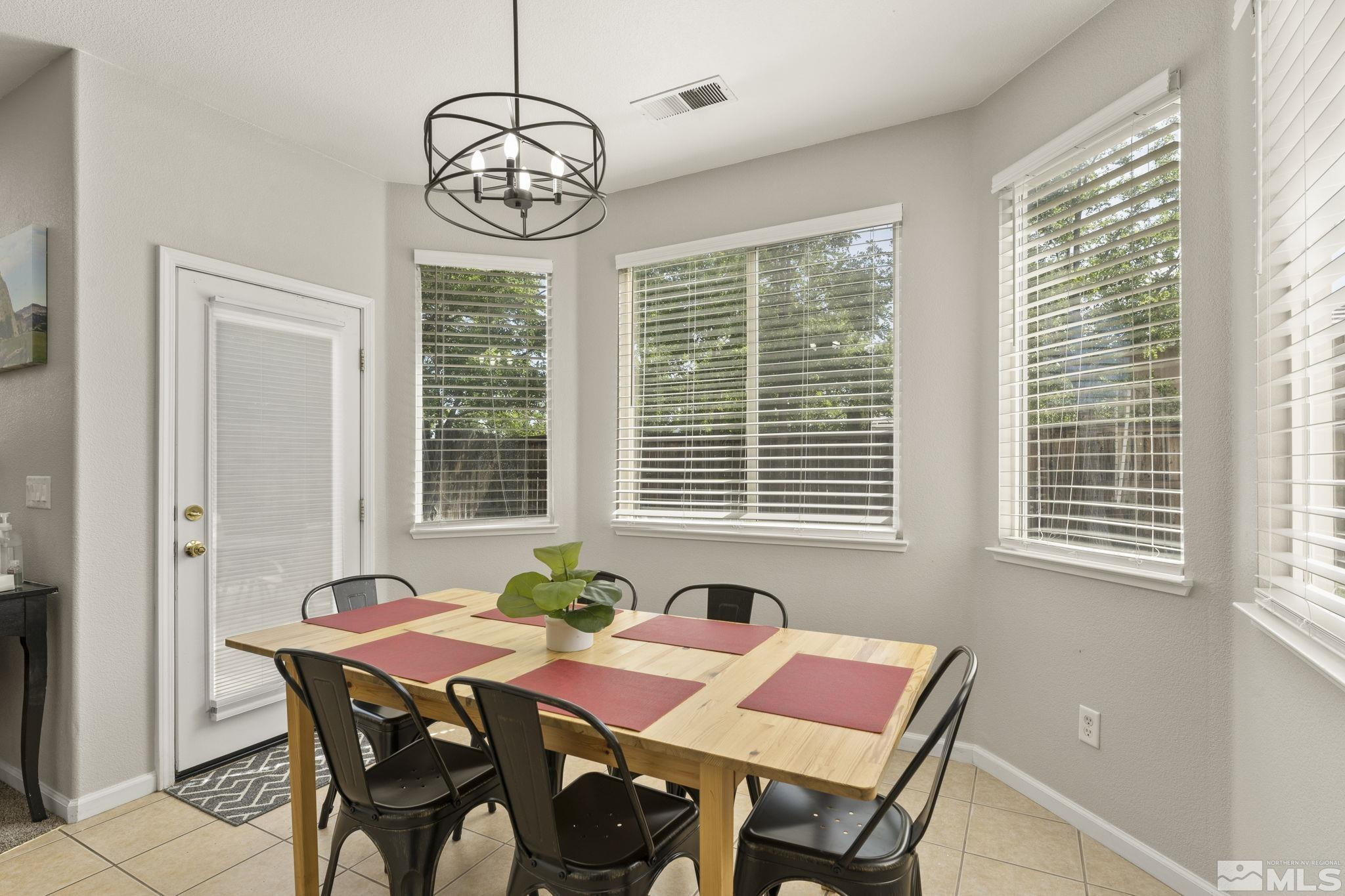10640 Arbor Way Reno, NV 89521 - Photo 12 of 37 a view of a dining room with furniture window and outside view