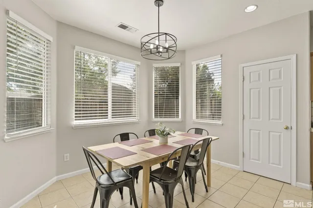 a view of a dining room with furniture window and outside view