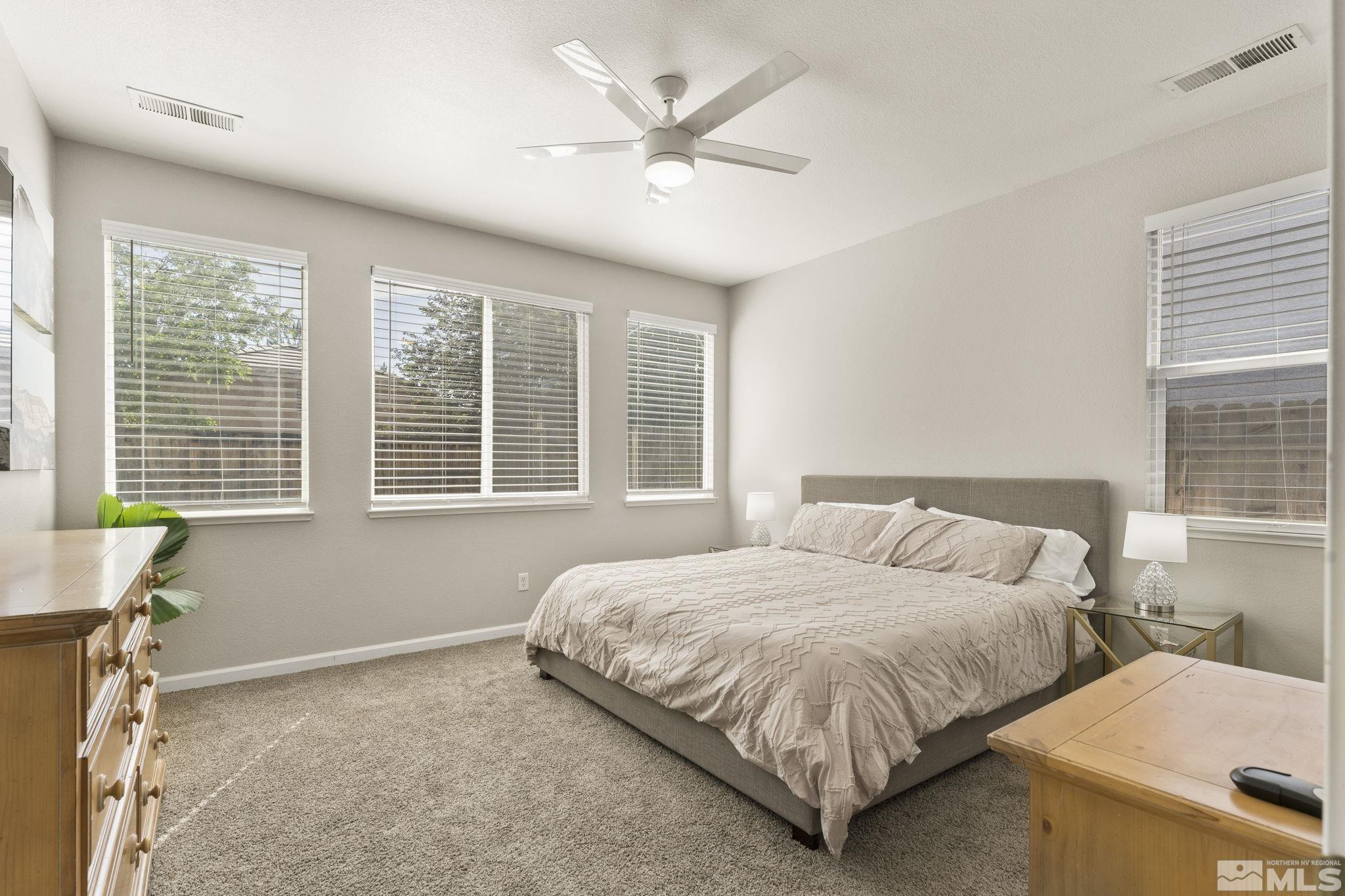 10640 Arbor Way Reno, NV 89521 - Photo 14 of 37 a bedroom with a bed and window