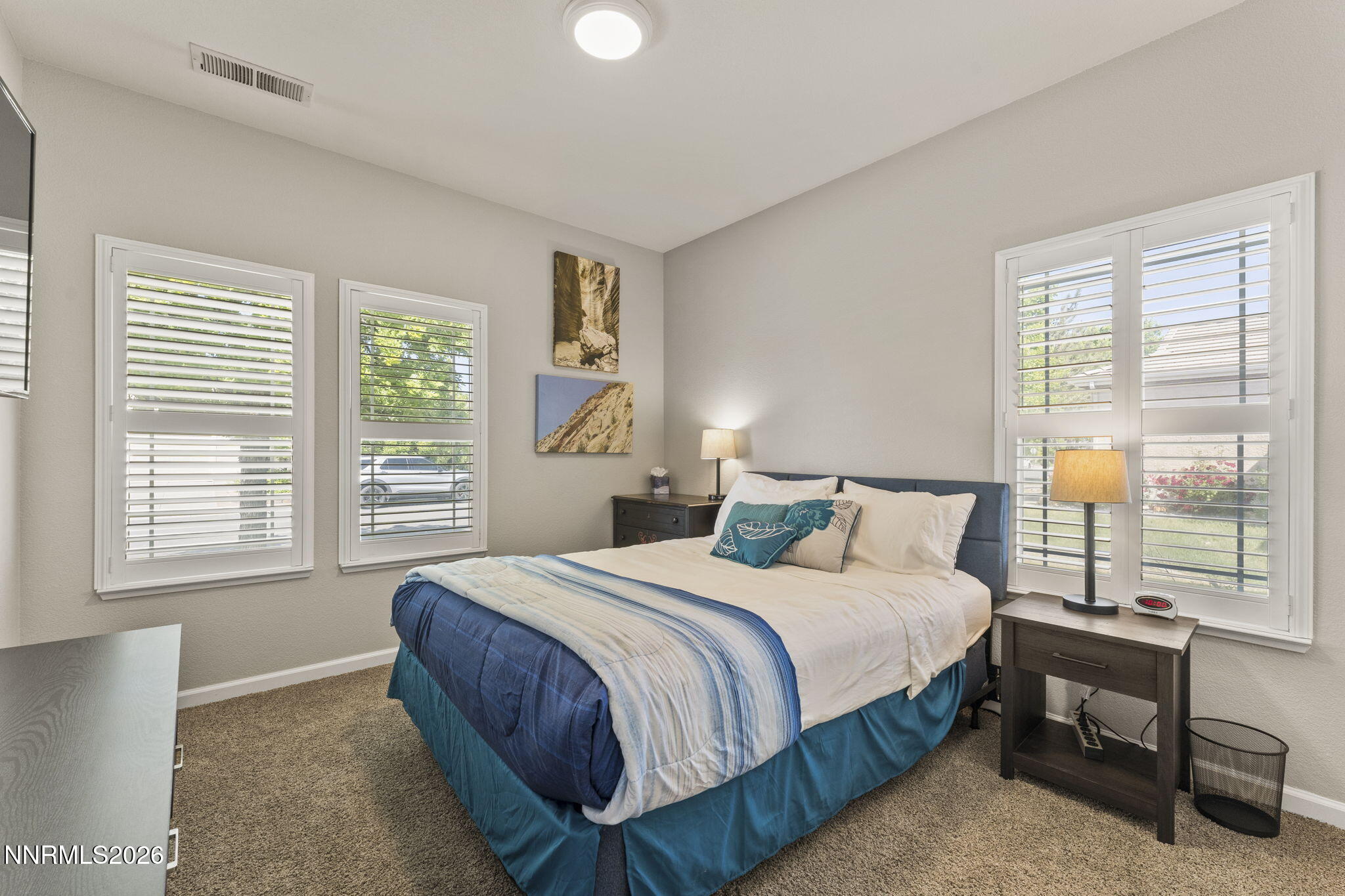 10640 Arbor Way Reno, NV 89521 - Photo 18 of 36 a bedroom with a bed a table and window