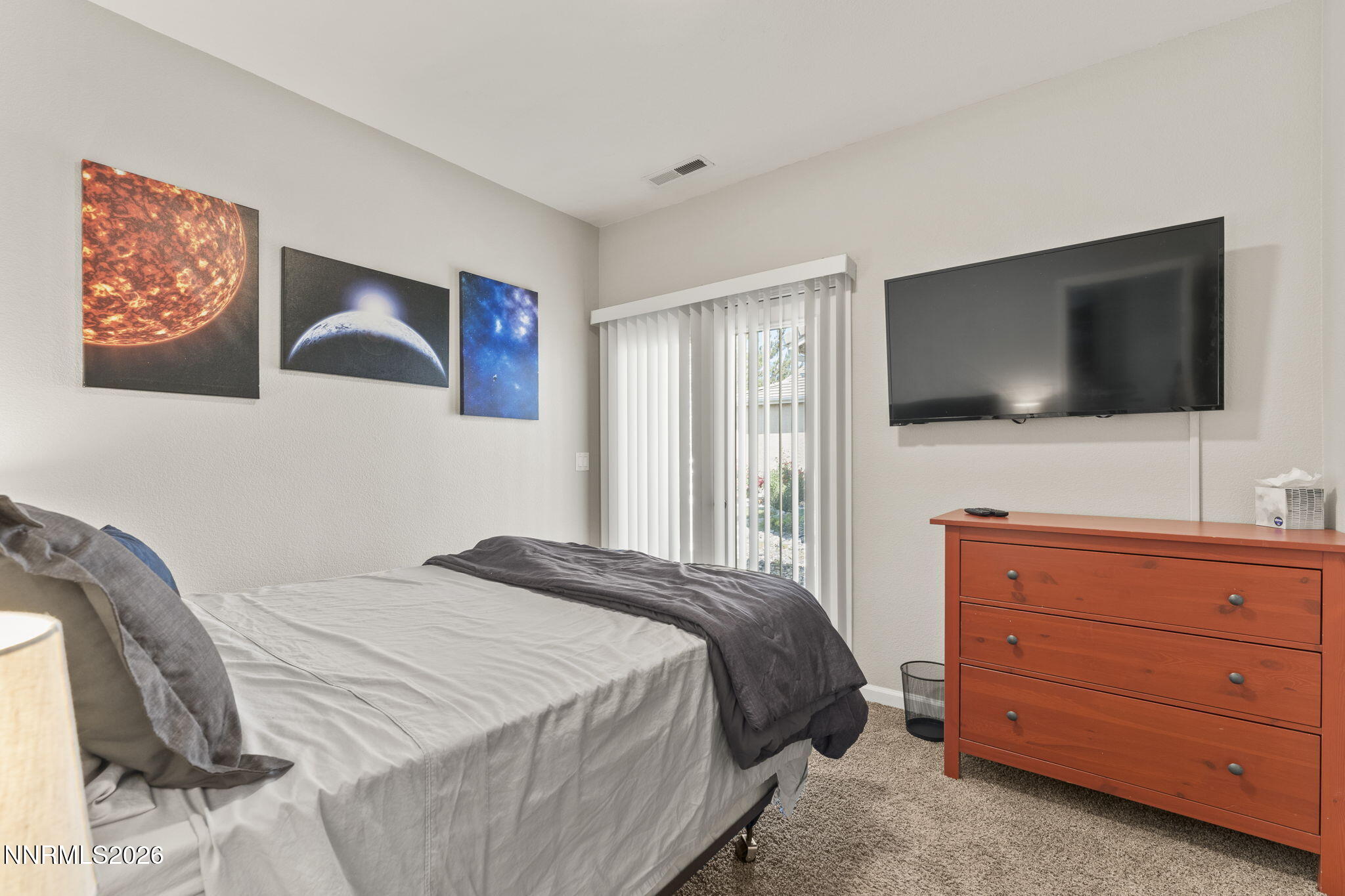 10640 Arbor Way Reno, NV 89521 - Photo 20 of 36 a bedroom with a bed and a flat screen tv