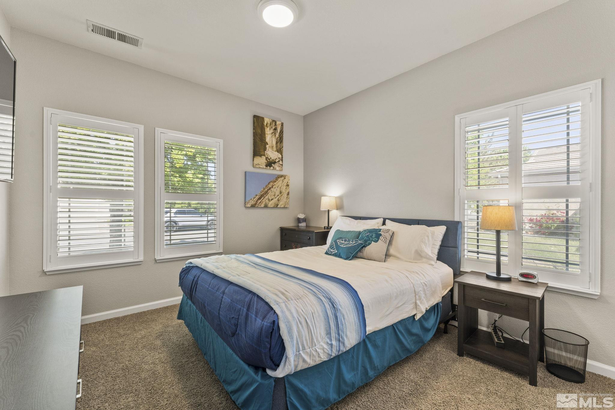10640 Arbor Way Reno, NV 89521 - Photo 20 of 37 a bedroom with a bed and a window
