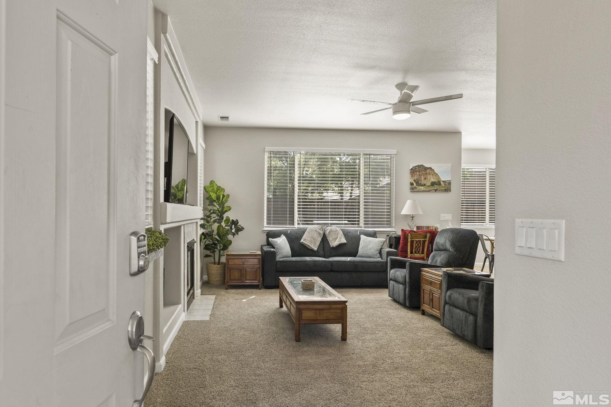10640 Arbor Way Reno, NV 89521 - Photo 2 of 37 a living room with furniture and a large window