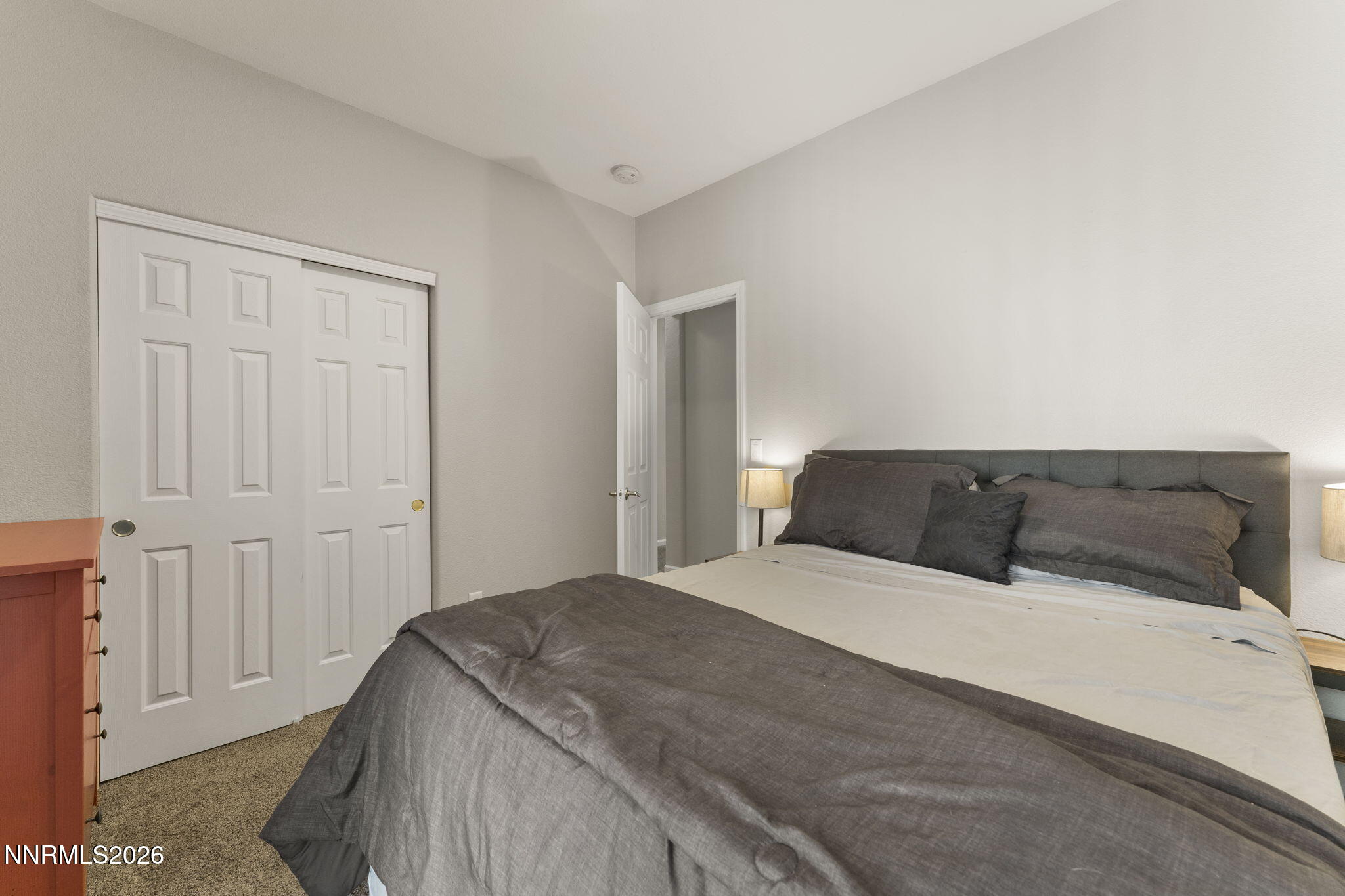 10640 Arbor Way Reno, NV 89521 - Photo 21 of 36 a bedroom with a large bed and a closet