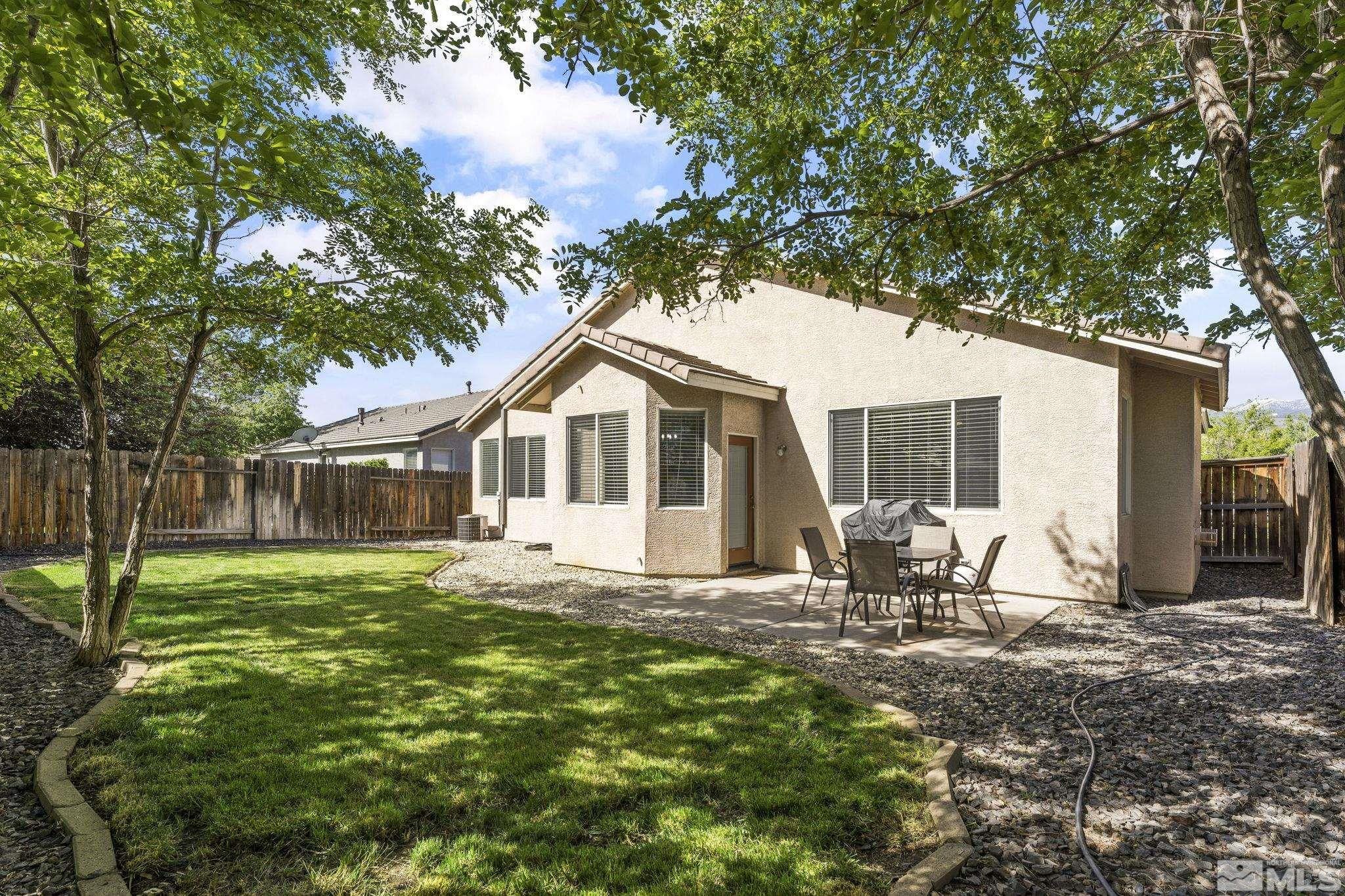10640 Arbor Way Reno, NV 89521 - Photo 31 of 37 a front view of house with yard and seating space