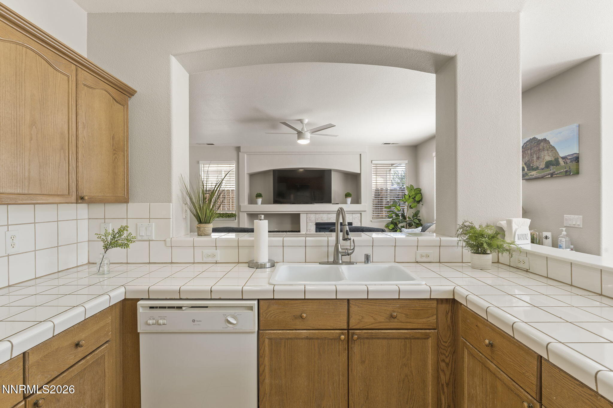 10640 Arbor Way Reno, NV 89521 - Photo 4 of 36 a kitchen with a sink and a wooden floor