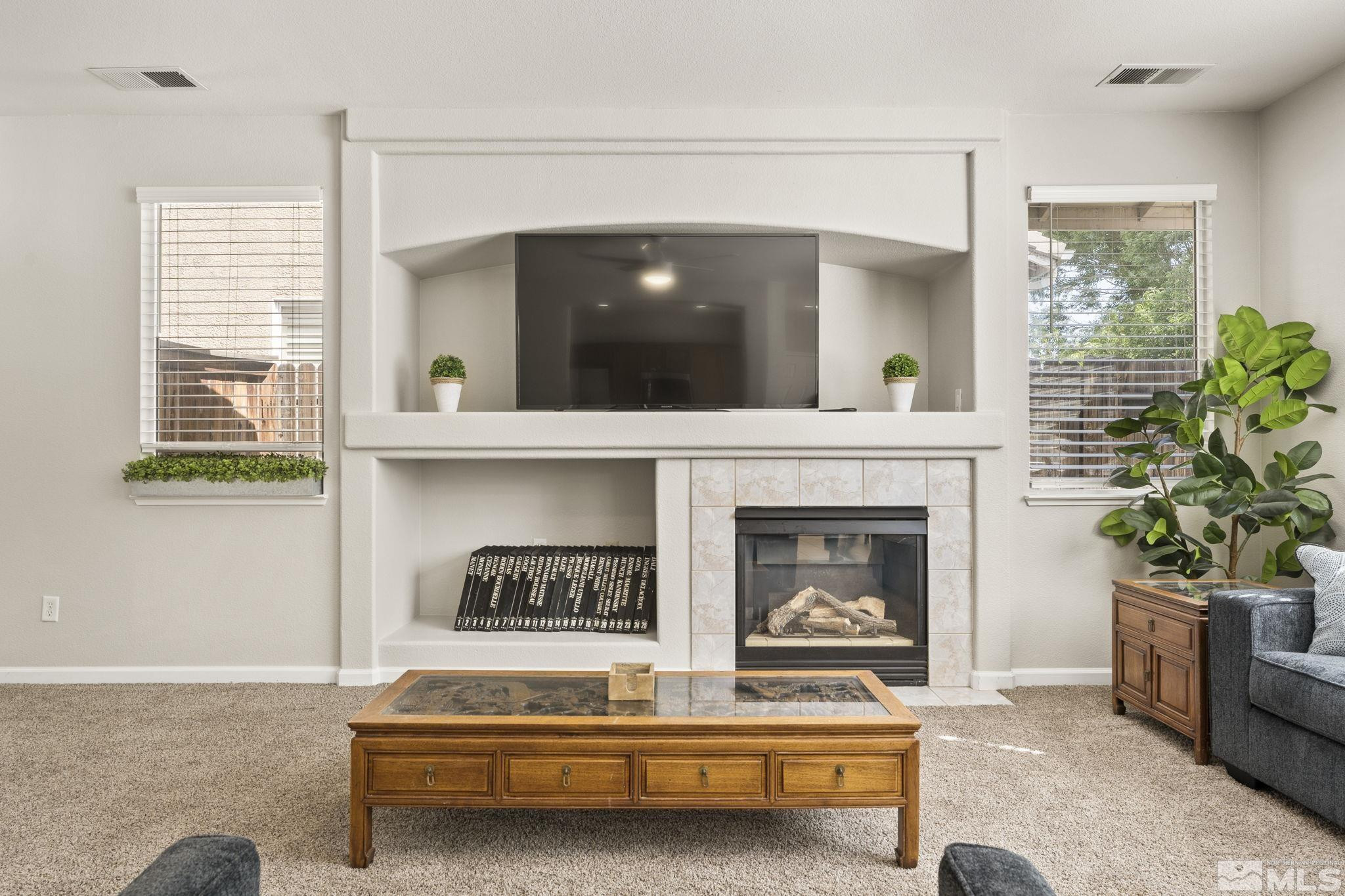 10640 Arbor Way Reno, NV 89521 - Photo 5 of 37 a living room with furniture and a fireplace