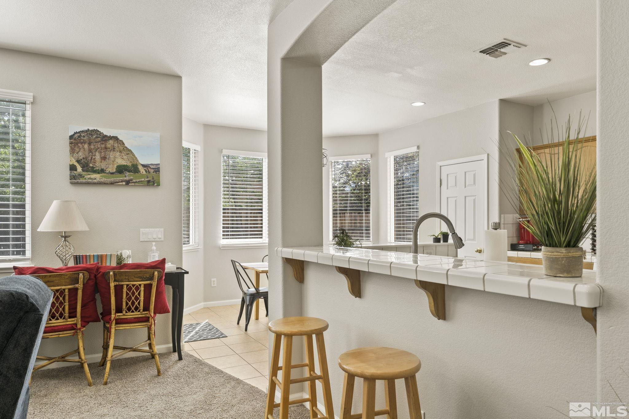 10640 Arbor Way Reno, NV 89521 - Photo 8 of 37 a view of a dining room with furniture window and outside view