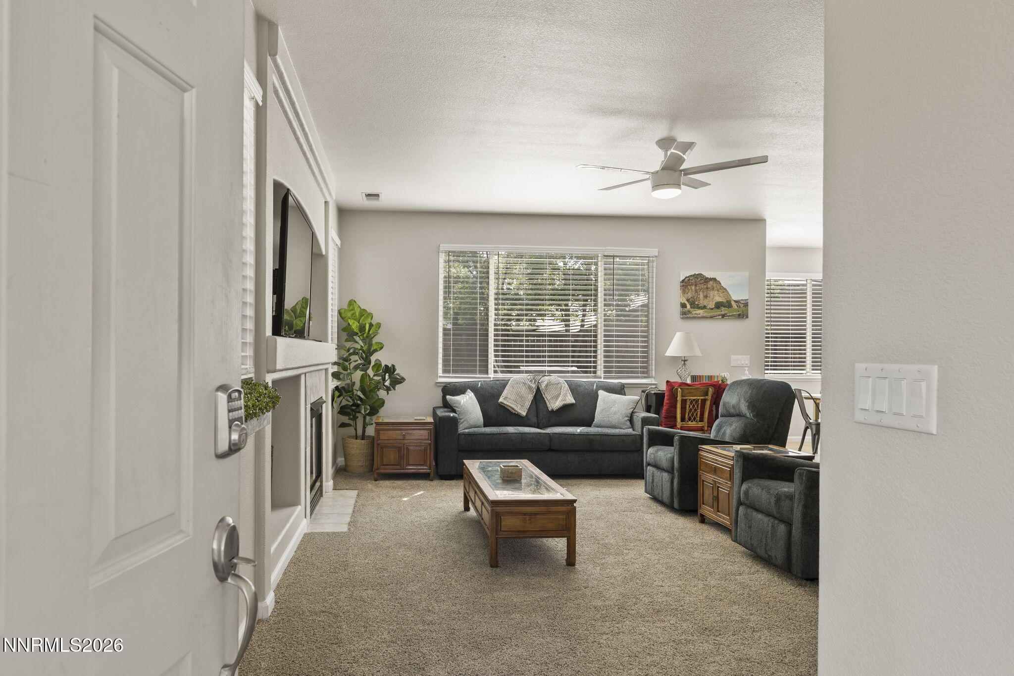 10640 Arbor Way Reno, NV 89521 - Photo 8 of 36 a living room with furniture and a large window