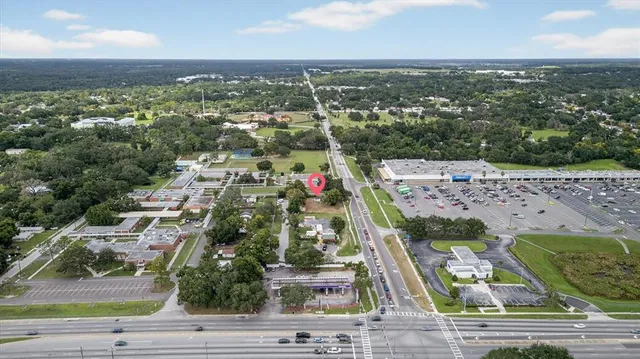 a view of a park with large trees