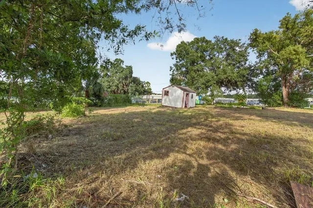 a view of a house with a yard and garage