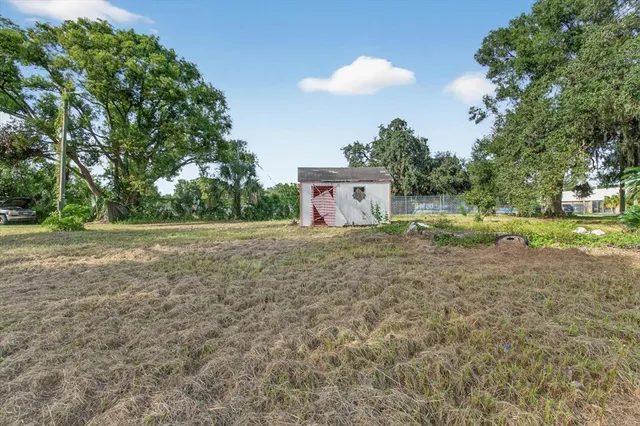 a backyard of a house with lots of green space