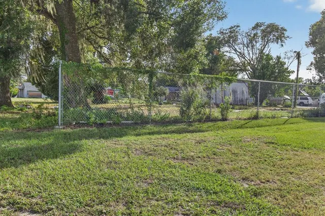 a view of a barn in the middle of a yard