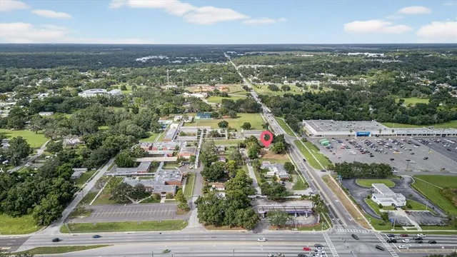 an aerial view of residential building and car parked