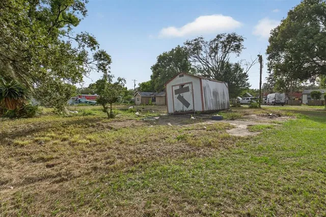 a backyard of a house with lots of green space