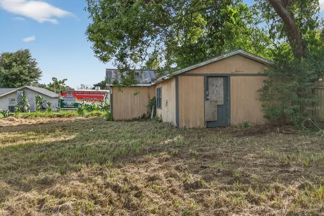 a backyard of a house with lots of green space