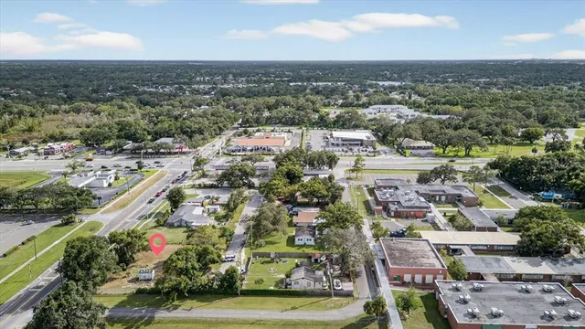 an aerial view of residential houses with outdoor space and river view