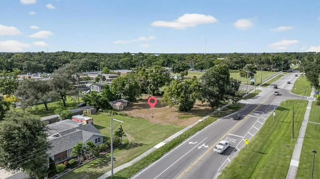 a view of a yard with potted plants