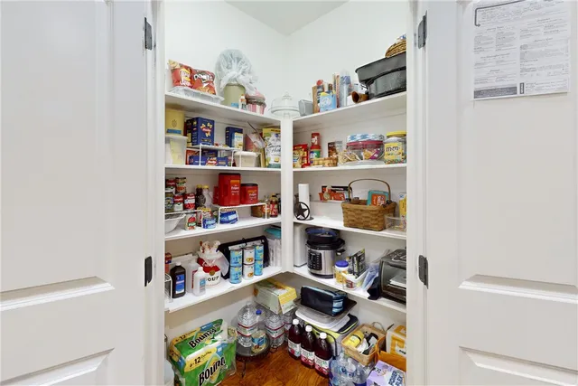 a stove top oven sitting inside of a kitchen
