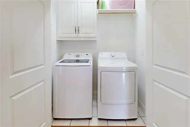 a view of cabinets with wooden floor and window