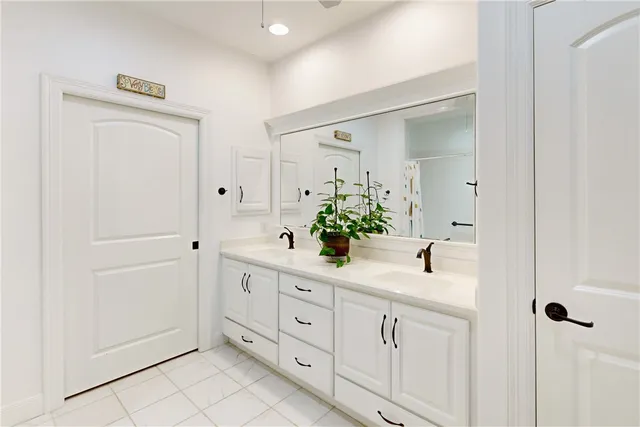 a view of a workspace with furniture and a flat screen tv