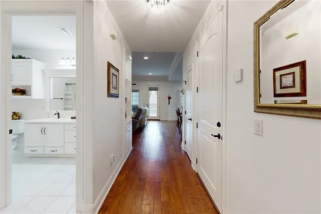 a view of a hallway with paintings on the wall