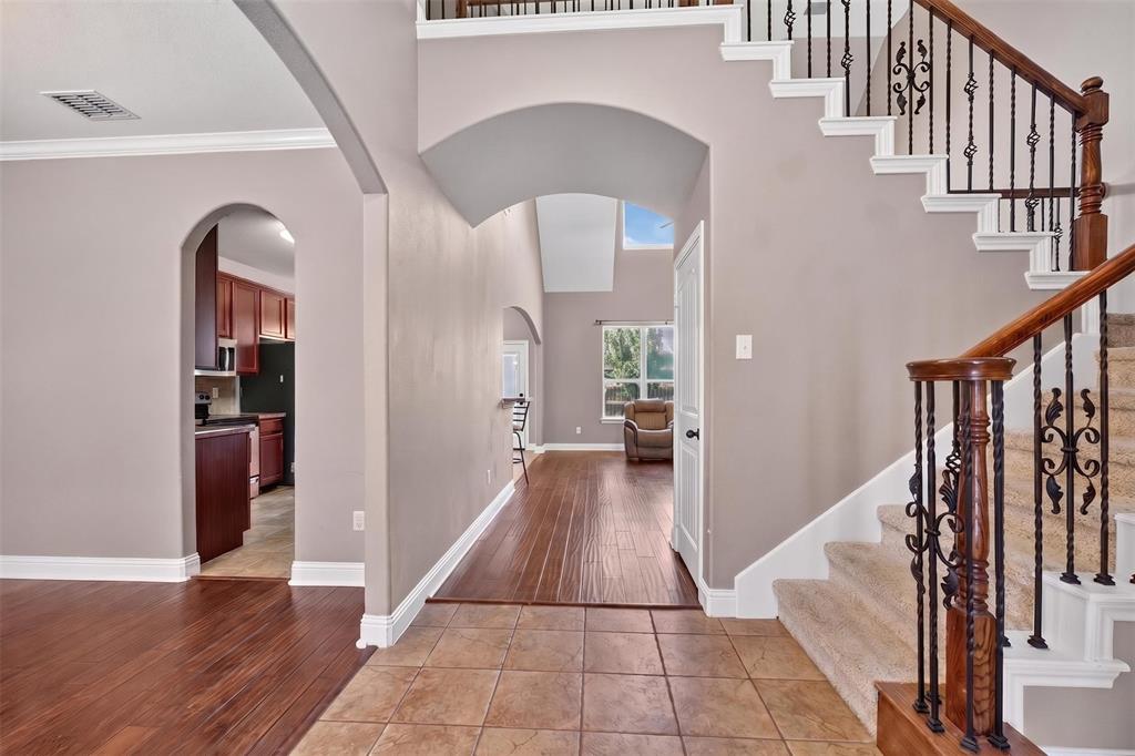 517 Austin Acre Road Sulphur Springs, TX 75482 - Photo 6 of 23 a view of a hallway with wooden floor and staircase
