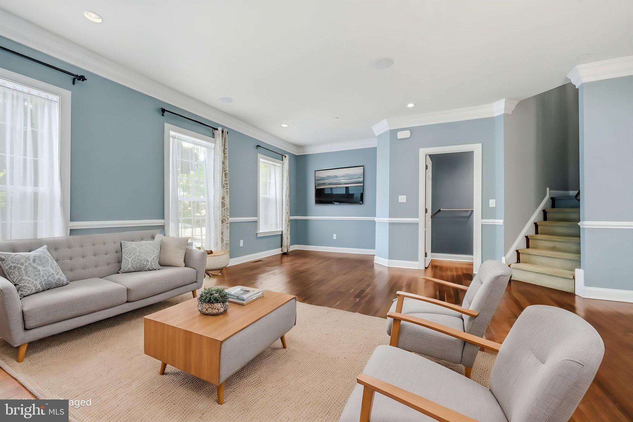 208 Jackdaw Alley, Unit 208 Springfield, PA 19064 - Photo 5 of 49 a living room with furniture and a large window
