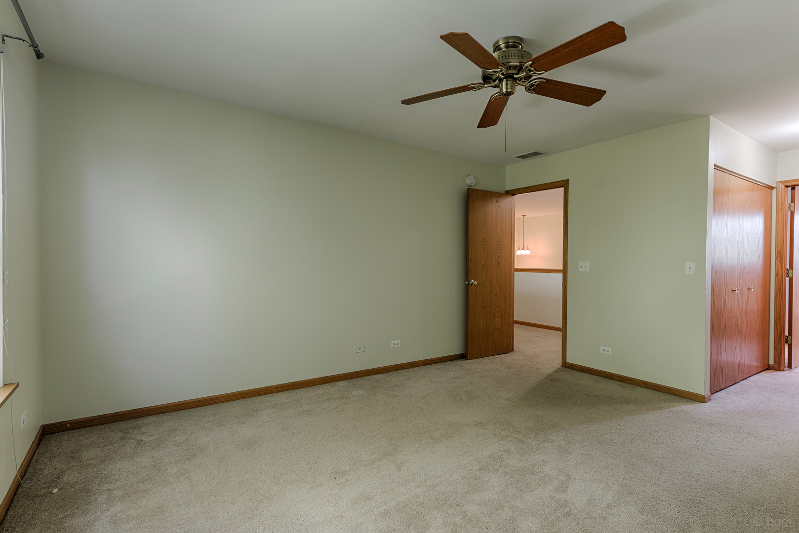 3261 Cool Springs Court Naperville, IL 60564 - Photo 11 of 25 an empty room with windows and fan