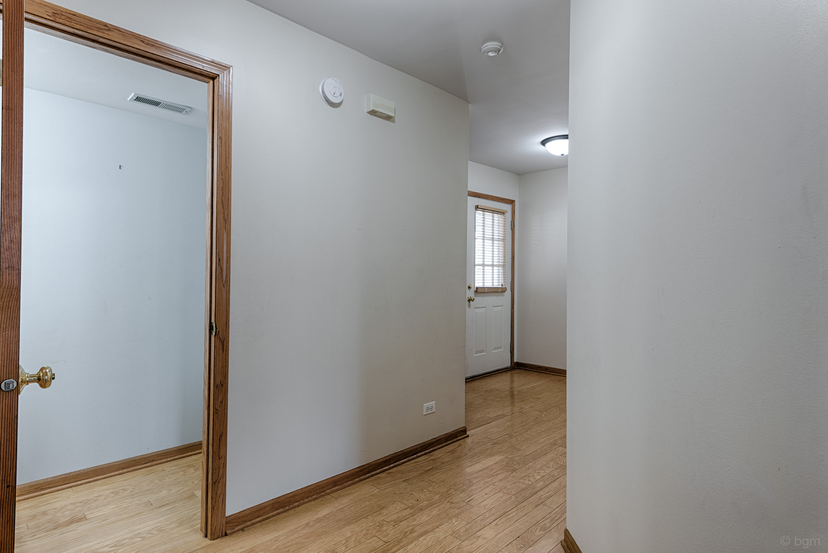 3261 Cool Springs Court Naperville, IL 60564 - Photo 19 of 25 a view of an empty room with wooden floor and closet