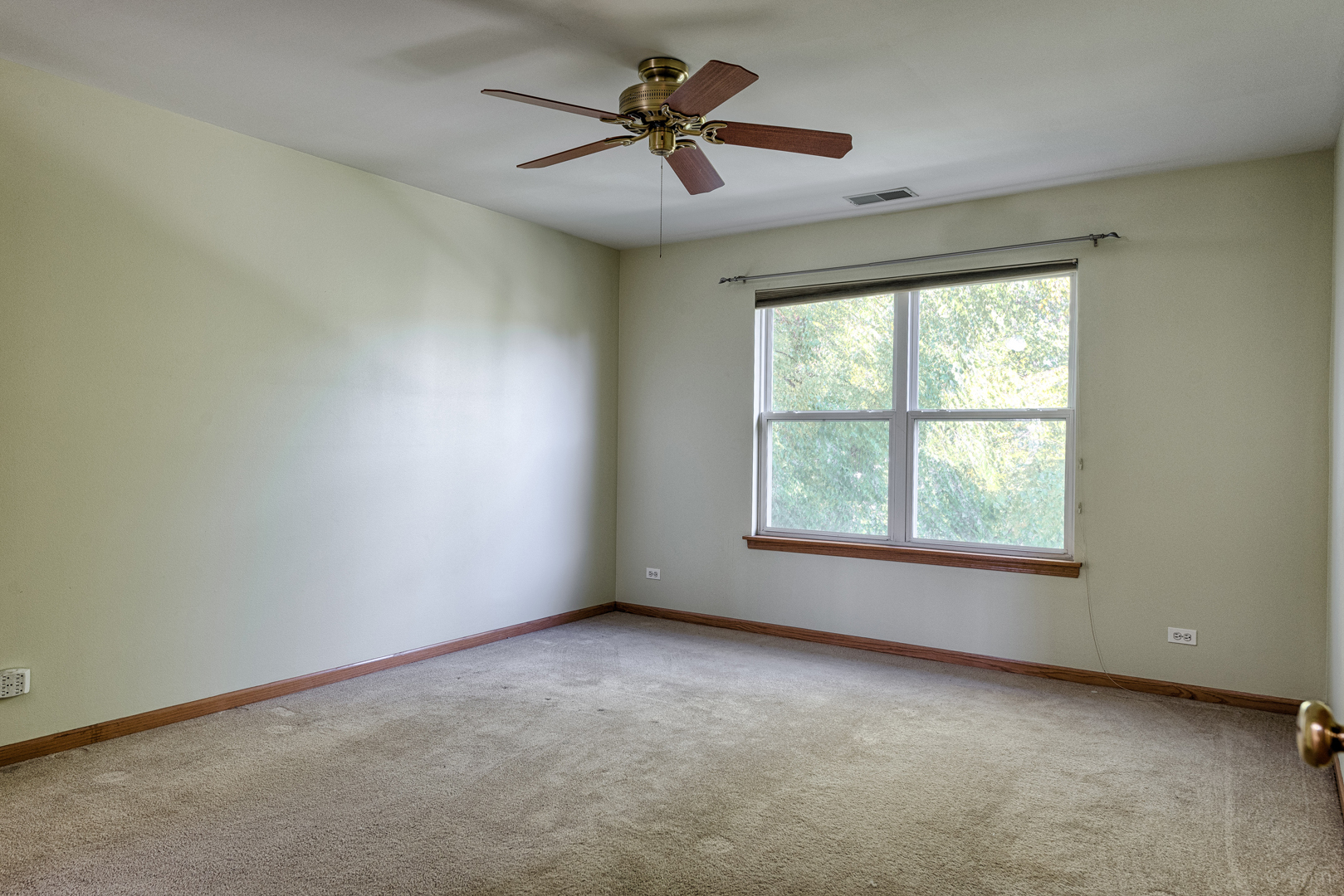 3261 Cool Springs Court Naperville, IL 60564 - Photo 8 of 25 an empty room with windows and fan