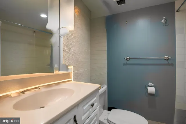 a bathroom with a sink and toilet