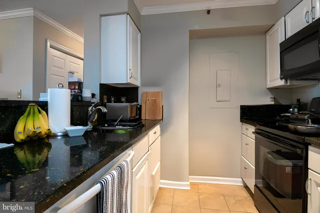 a kitchen with a stove and a microwave