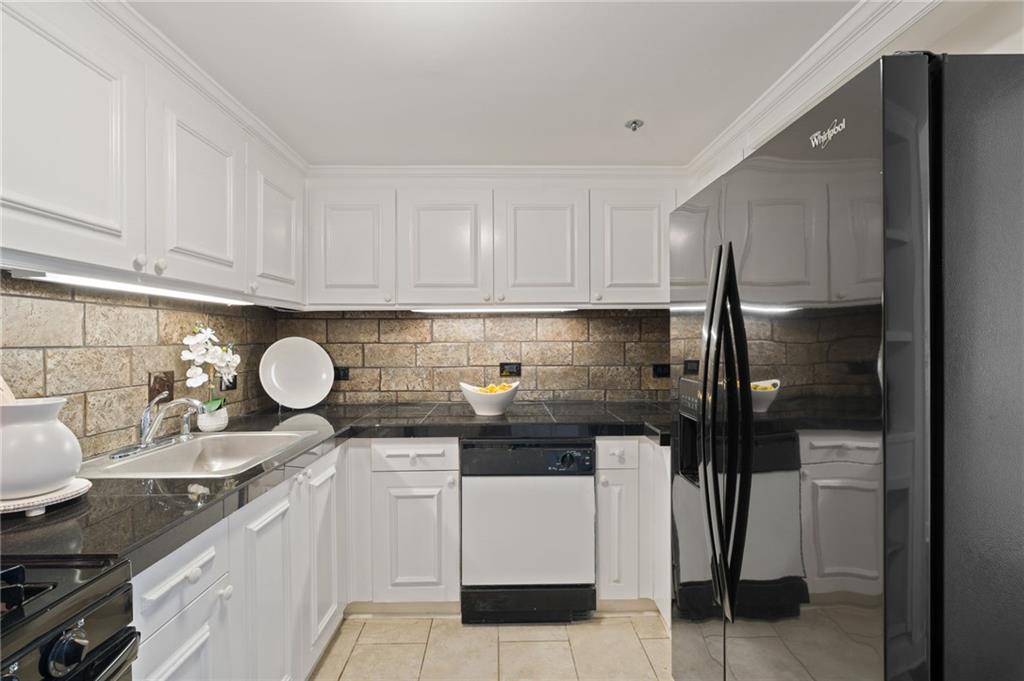 1501 Clairmont Road, Unit 1731 Decatur, GA 30033 - Photo 17 of 30 a kitchen with a sink and cabinets