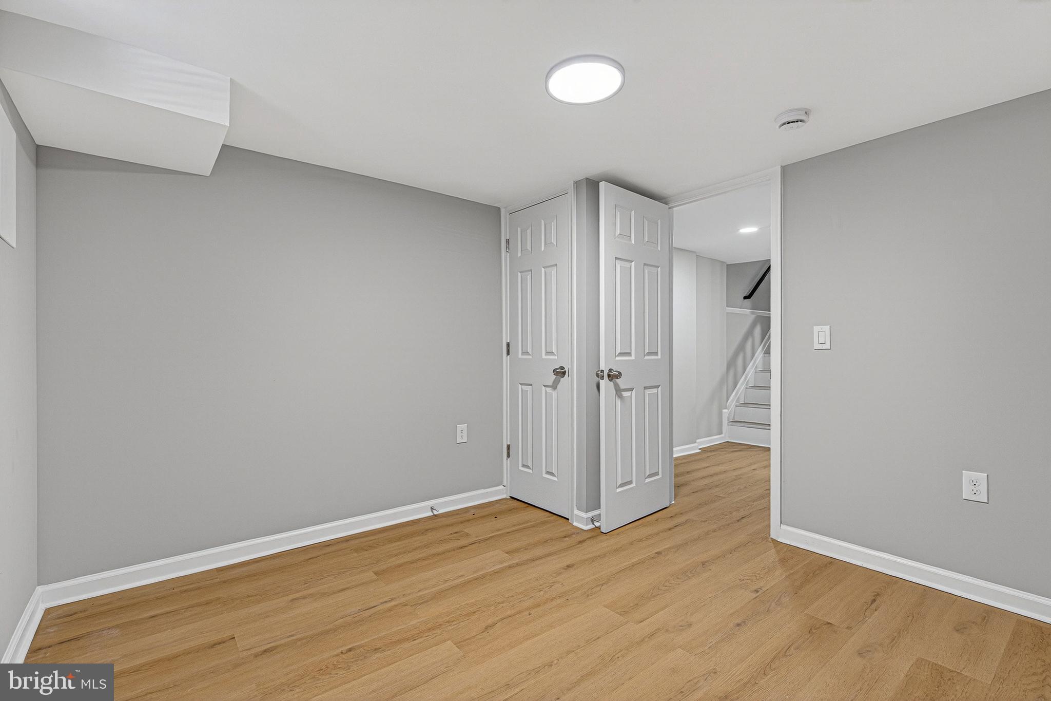 2518 West Fayette Street Baltimore, MD 21223 - Photo 25 of 32 a view of an empty room and wooden floor