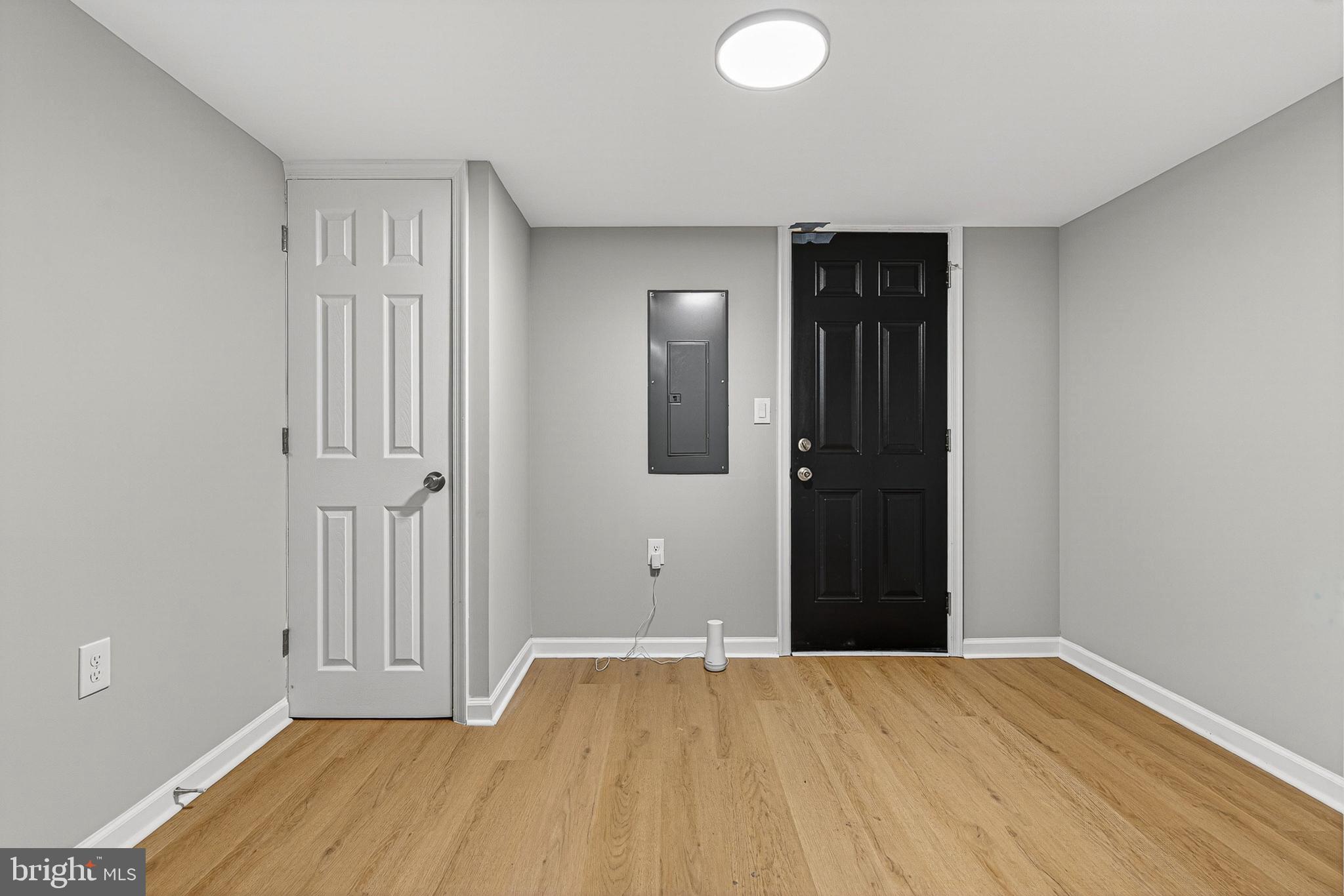 2518 West Fayette Street Baltimore, MD 21223 - Photo 28 of 32 a view of an empty room with wooden floor