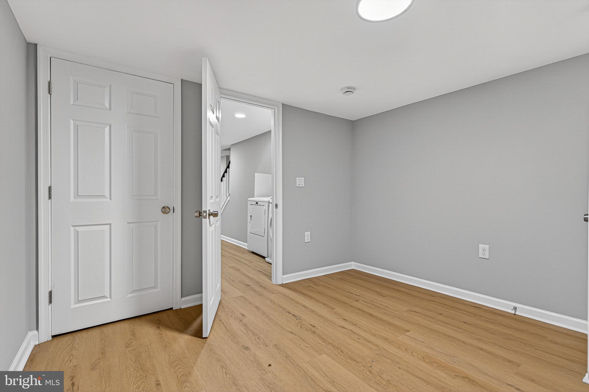 2518 West Fayette Street Baltimore, MD 21223 - Photo 29 of 32 wooden floor in an empty room