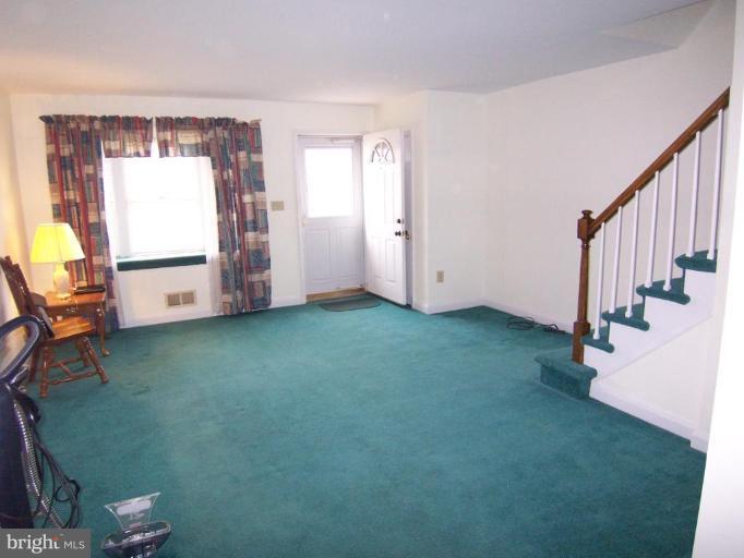 1948 Frames Road Dundalk, MD 21222 - Photo 3 of 6 a view of an empty room with a window