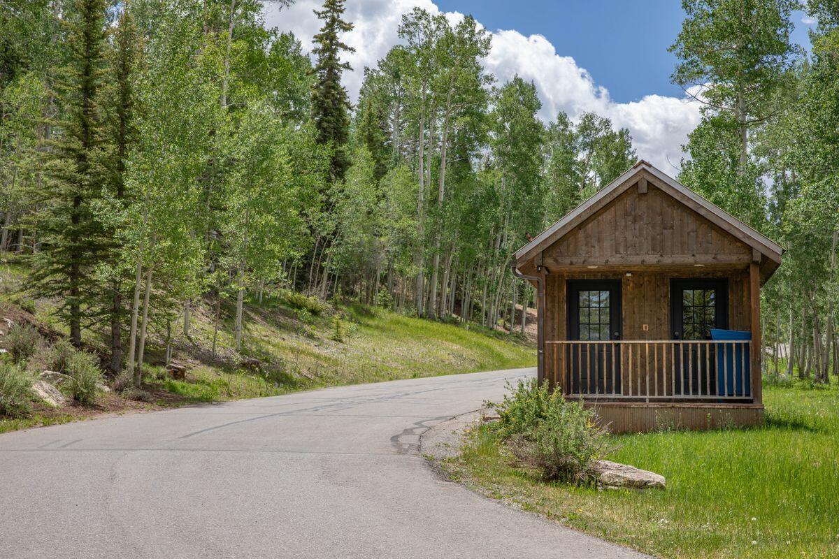 Tbd Elk Run Telluride, CO 81435 - Photo 9 of 18 a front view of a house with garden