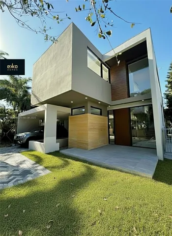 a view of an chairs and table in a room