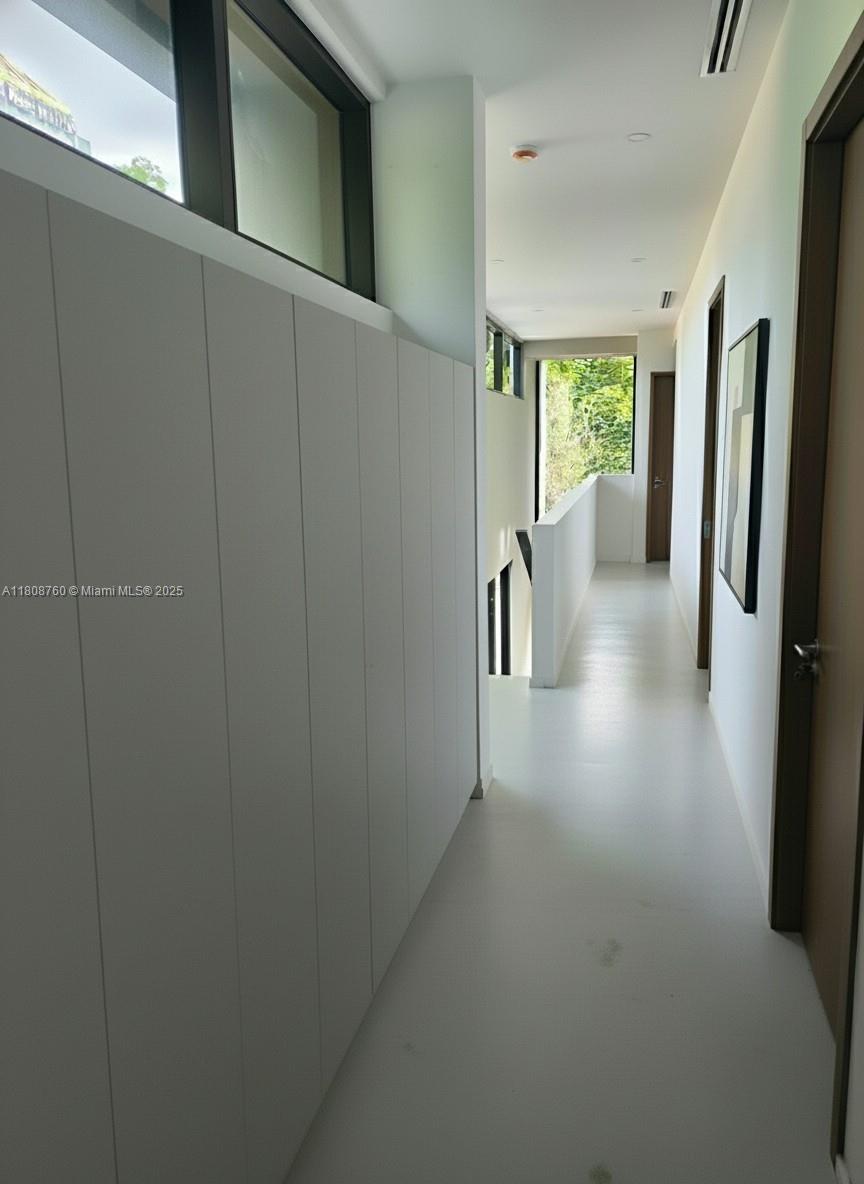 234 Southwest 22nd Road Miami, FL 33129 - Photo 16 of 31 a view of hallway with furniture and a window