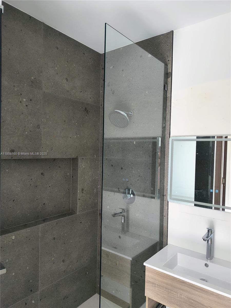 234 Southwest 22nd Road Miami, FL 33129 - Photo 18 of 31 a bathroom with a bathtub and a sink